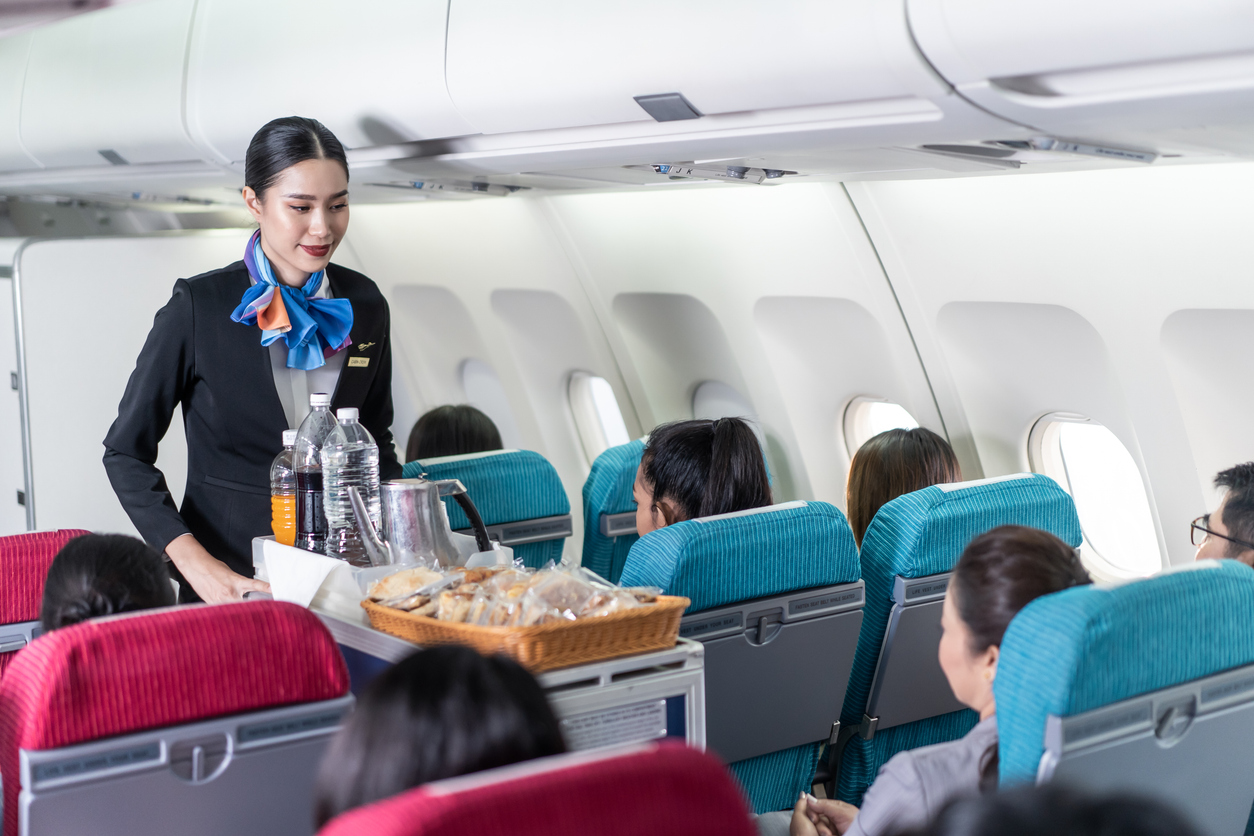 cabin crew pushing trolley