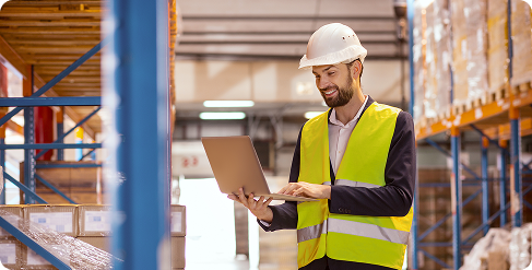man with yellow vest in warehouse